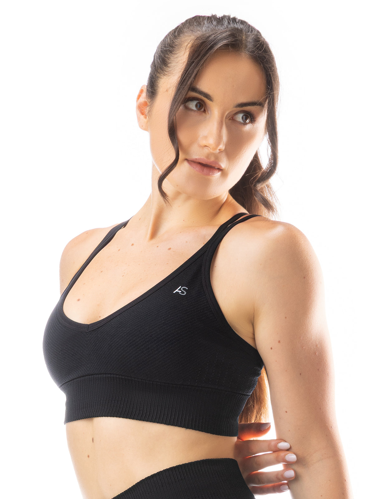 Top sportivo scollo a V e spalline incrociate