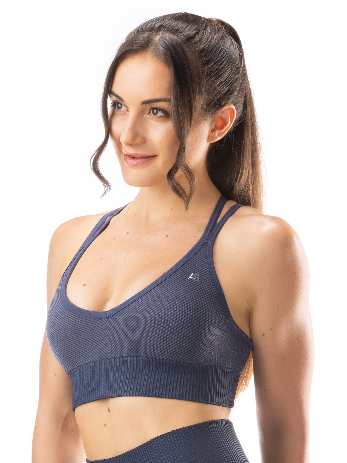 Top sportivo scollo a V e spalline incrociate