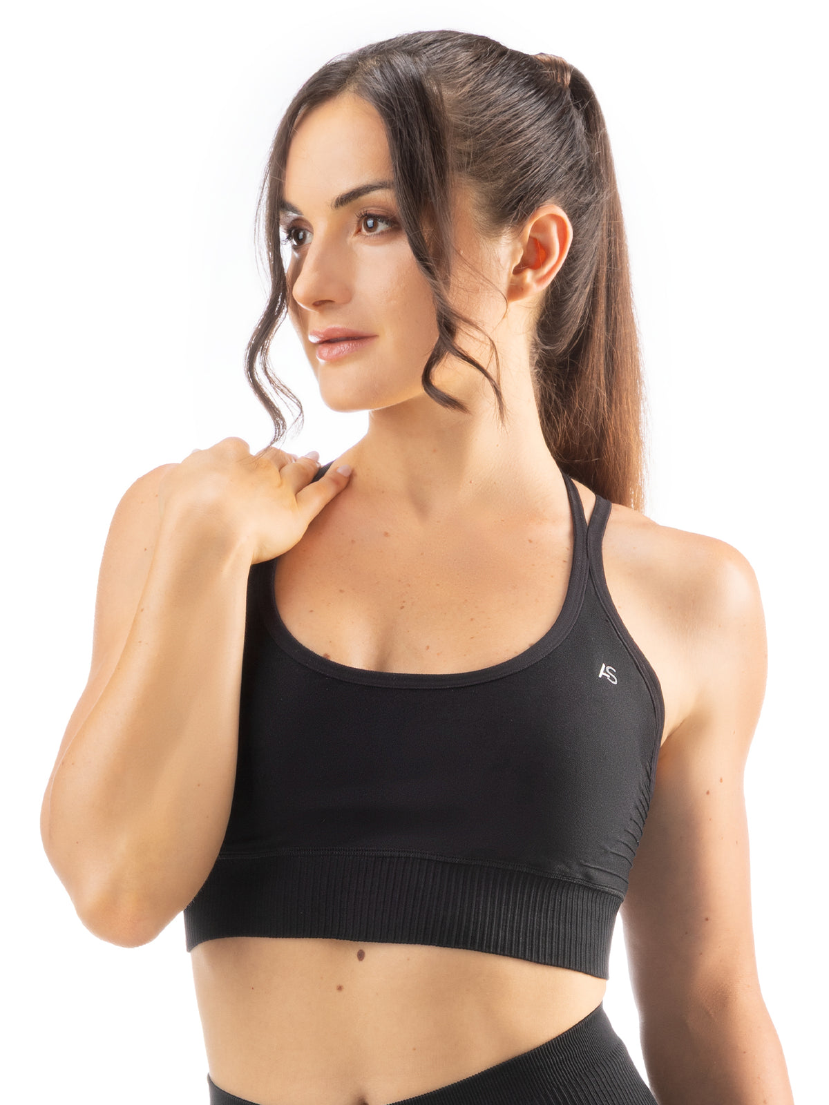 Top sportivo con incrocio sulla schiena e design a costine