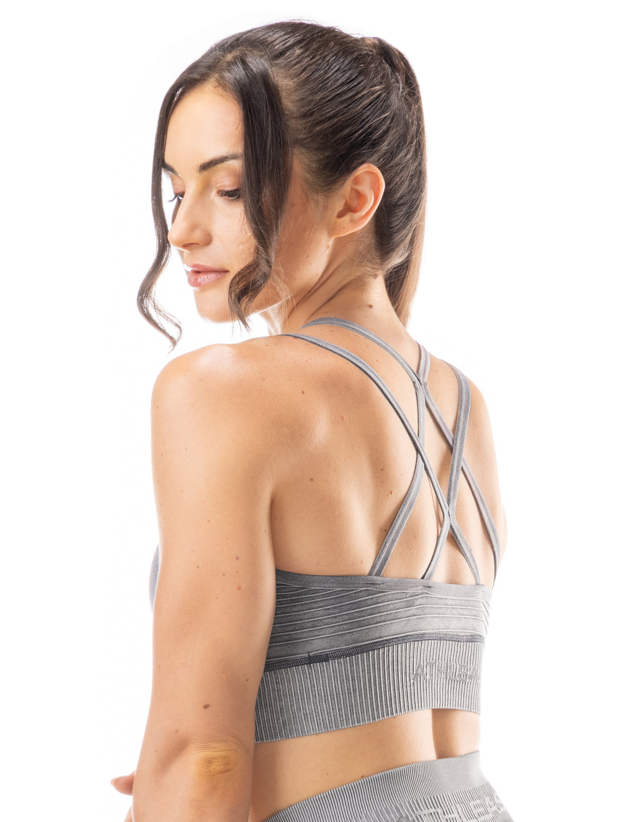 Top sportivo con incrocio sulla schiena e design a costine