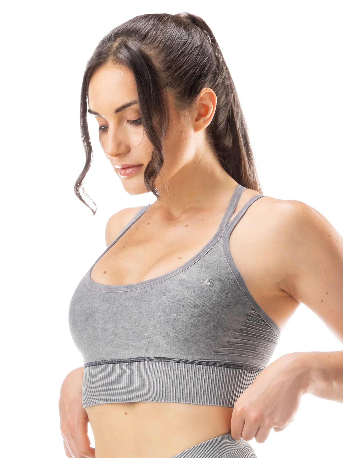 Top sportivo con incrocio sulla schiena e design a costine